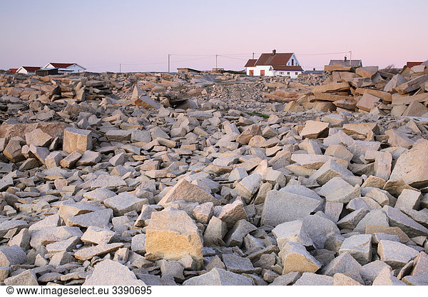 Crushed stone with houses in the background