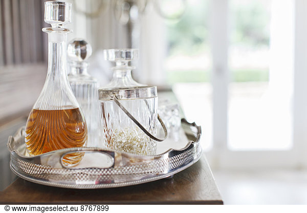 Crystal alcohol decanters on silver tray