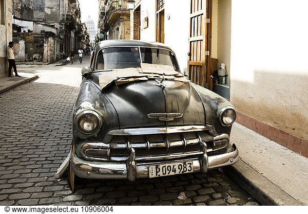 Cuba  Havana  parking black vintage car on a road in the old town