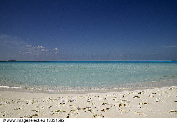 CUBA Isla De Juventud Cayo Largo Playa Serena beach looking out to sea with footprints in the white sand