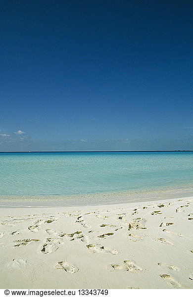 CUBA Isla De Juventud Cayo Largo Playa Serena looking out to sea with footprints in the sand