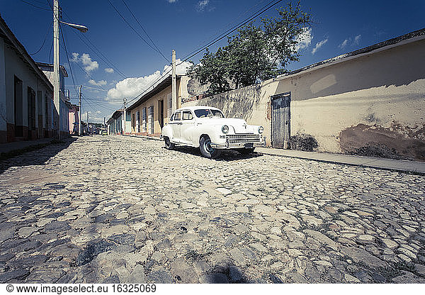 Cuba  parking white vintage car on a road