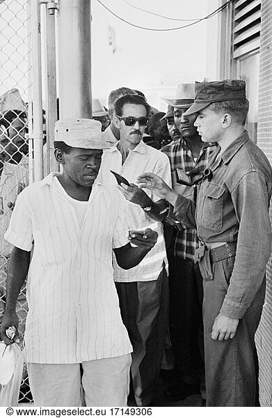 Cuban Workers exiting for the day  Guantanamo Bay U.S. Naval Base  Cuba  Warren K. Leffler  November 12  1962