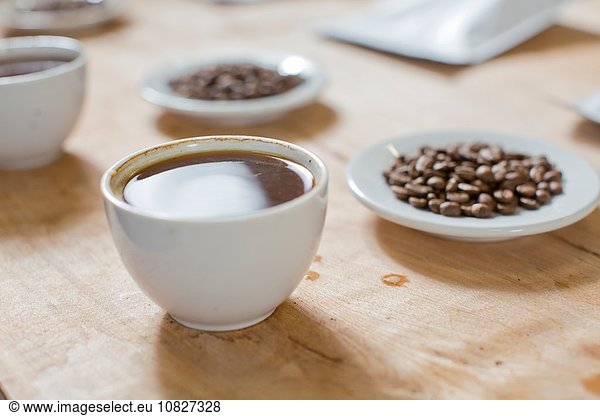 Cups of coffee  saucers of coffee beans