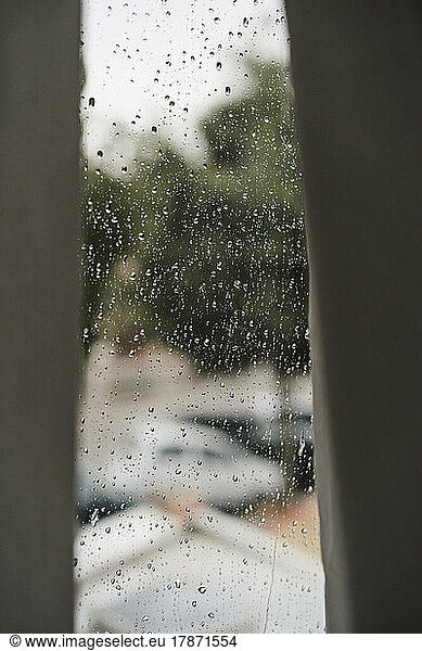 Curtains by window on rainy day at home