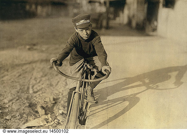 Curtis Hines  14 years old  Western Union Messenger  Works 4:00-8:00 p.m.  Full-Length Portrait Sitting on Bicycle  Houston  Texas  USA  Lewis Hine for National Child Labor Committee  October 1913