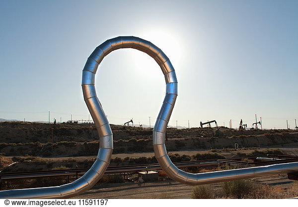 Curved pipe at oil field