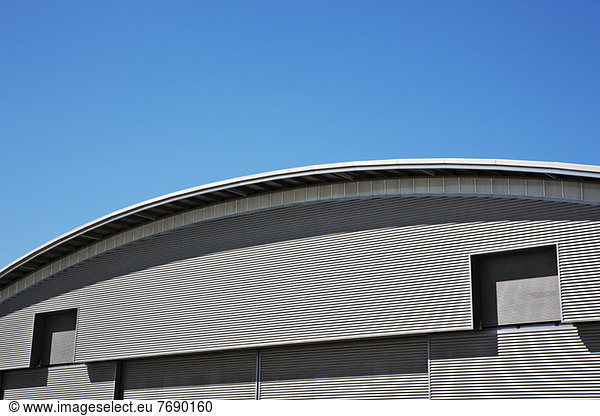 Curved roof and blue sky