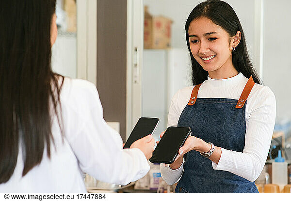 Customer making payment using NFS technology