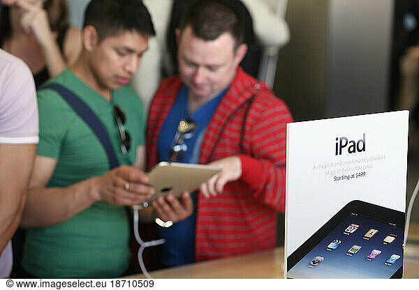 Customers try out Apple's new iPad in Manhattan  New York City.