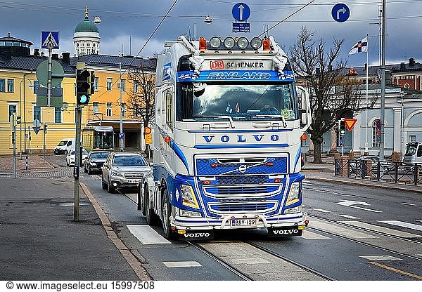 Customised blue and white Volvo FH truck of Kuljetusliike Kungas Ky in city traffic on the way to pick up trailer. Helsinki  Finland. April 29  2020.