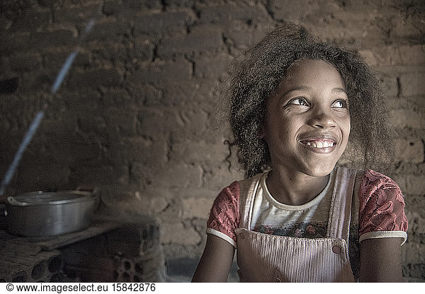 Cute Afro-Brazilian girl from quilombo Barra de Aroeira  smiling