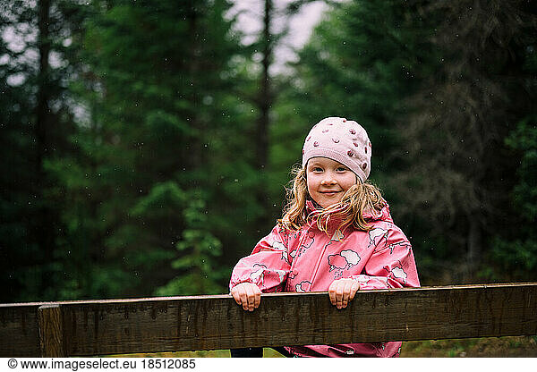 Cute girl in green Icelandic forest