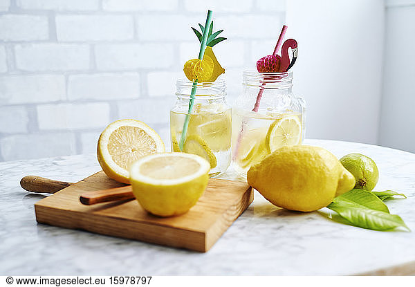 Cutting board  lemons and jars of fresh homemade lemonade