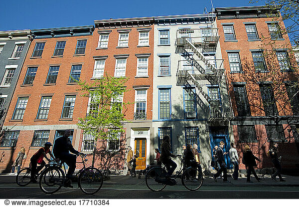 Cycling In Front Of Some Apartments Buildings In The West Village  Manhattan  New York  Usa