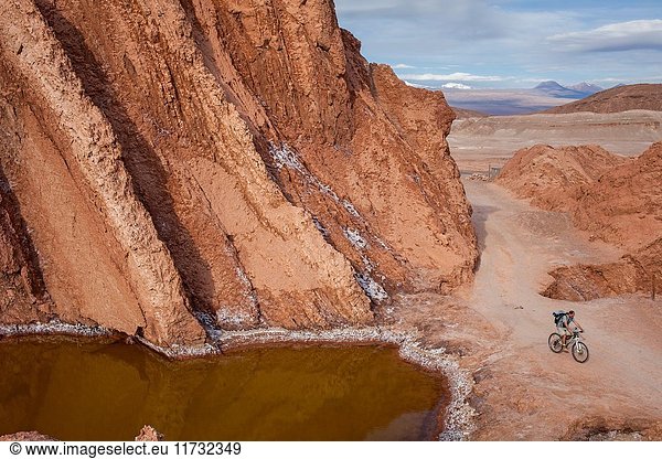 Cyclist  in Valle de la Muerte (Valley of the Death)  Atacama desert. Region de Antofagasta. Chile.