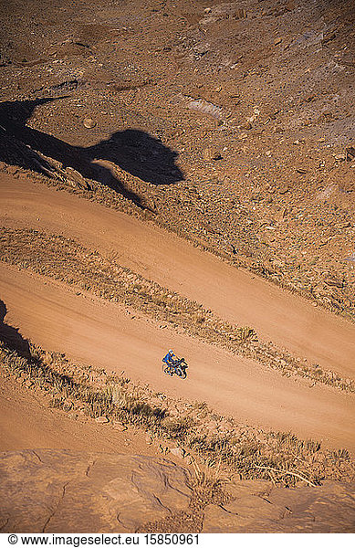 Cyclist on the road up from Mineral Bottom  White Rim Trail