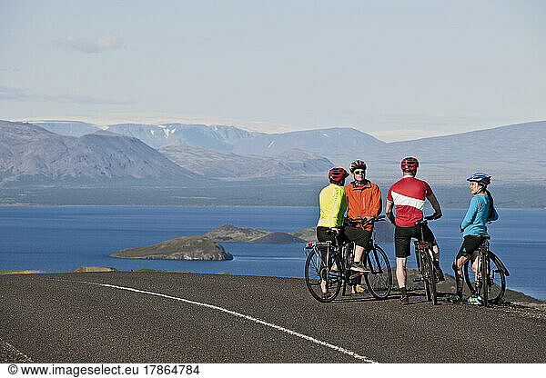 Cyclist stopping at viewpoint above Thingvallavatn lake