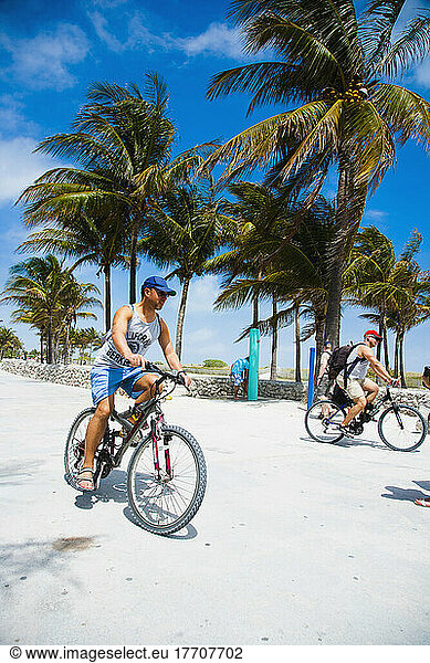 Cyclists On Promonade  Ocean Drive; South Beach  Miami  Florida  Usa.