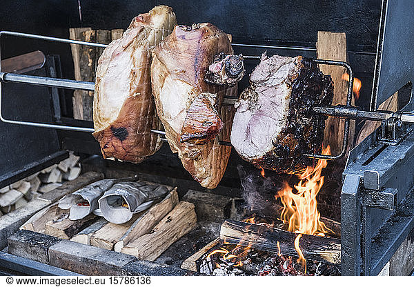 Czech Republic  Close-up of pork spit-roasting outdoors