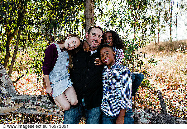Dad & Kids Hugging & Smiling for Camera at Park in Chula Vista