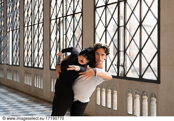 Dance partners tilting back together