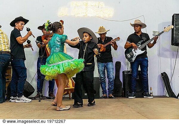 Dancing couple at Floklereabend  boy  girl  music band  La Macarena  Colombia  South America