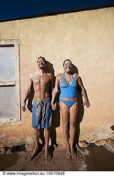 Darcy and Michael Schwerin covered in mud at Ojo Caliente Mineral Springs  New Mexico.