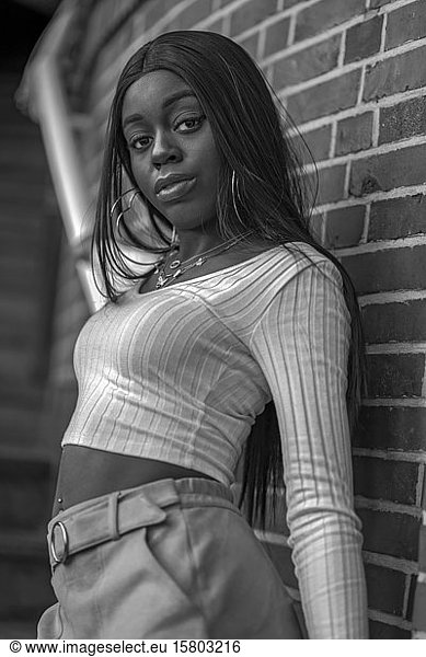 Dark skinned young woman on stairs  black and white  Düsseldorf  Germany  Europe