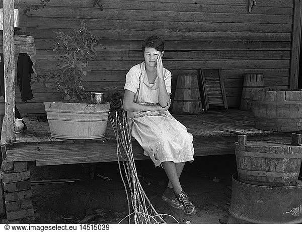 Daughter of Farmer who will be Resettled  Portrait sitting on Porch  Wolf Creek Farms  Georgia  USA  Arthur Rothstein  Farm Security Administration  September 1935