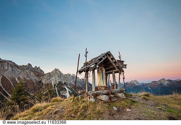 Dawn at a shine in Carnic Alps near Sappada  Dolomites  Italy.