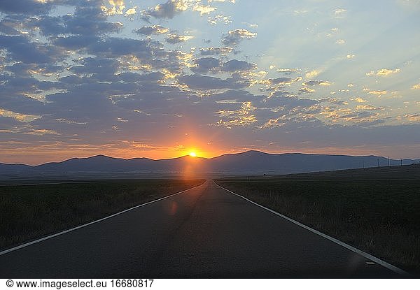Dawn in an empty road