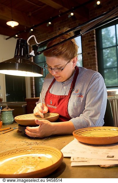 Dearborn  Michigan - An artisan in the pottery shop at Greenfield Village.
