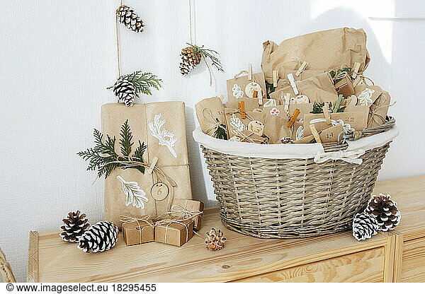 Decorated paper bags for DIY advent calendar and kept in basket