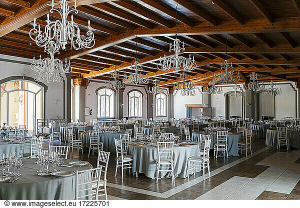 Decorated room with tables and chairs for event