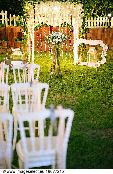 Decorated wedding arch. Wedding ceremony in the woods.