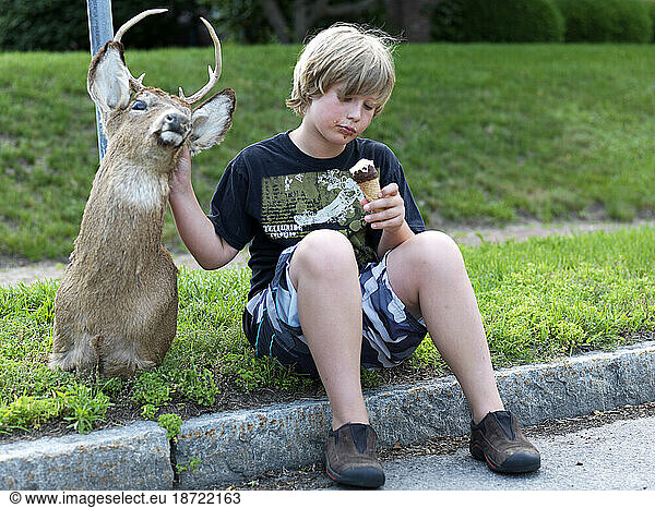 deer  boy and ice cream on the curb