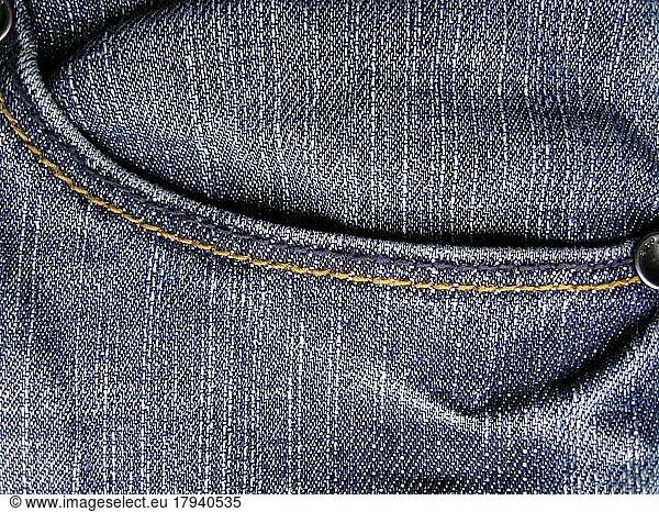 Denim jeans as blue background. With trouser pocket shown in full image in the plane