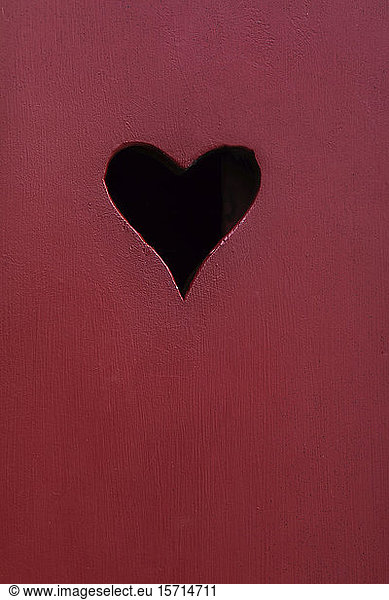 Denmark  Copenhagen  Heart-shaped hole in red wooden surface
