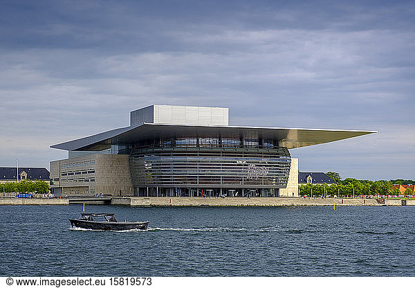 Denmark  Copenhagen  Motorboat passing in front of Copenhagen Opera House