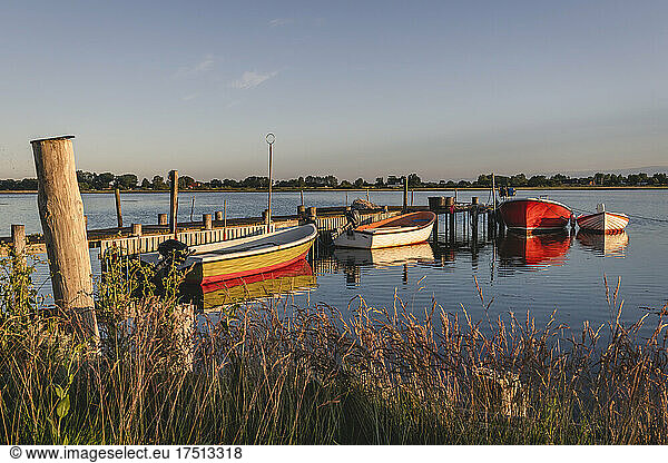 Denmark  Region of Southern Denmark  Ommel  Motorboats moored to coastal jetty at dusk