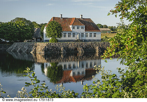 Denmark  Region of Southern Denmark  Soby  Sobygard museum reflecting in surrounding moat