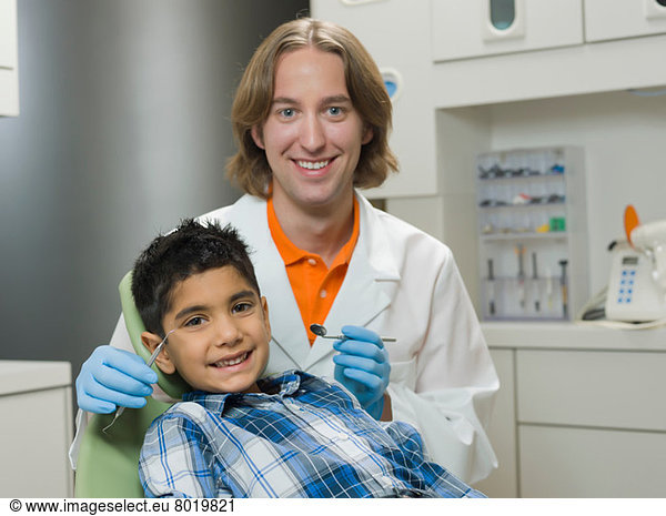 Dentist and young boy smiling  portrait