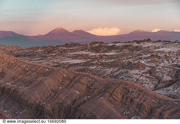 Desert Ridgeline in Atacama with scenic volcanos in the background