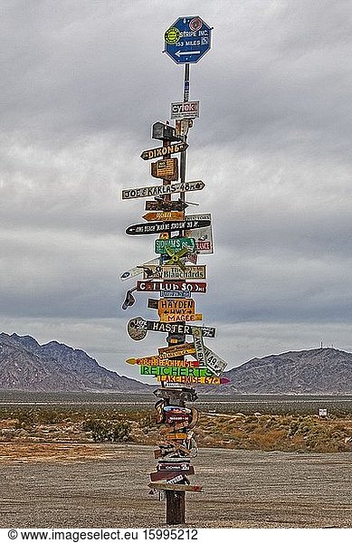 Destination sign pole in Mojave Desert  Rice  California  USA.