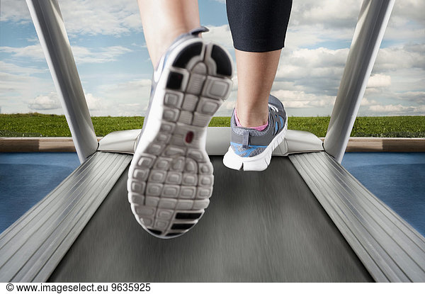 Detail close up woman feet treadmill running shoes