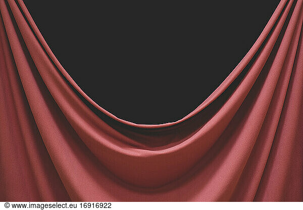 Detail of draped fabric  focus on folds and creases with black background