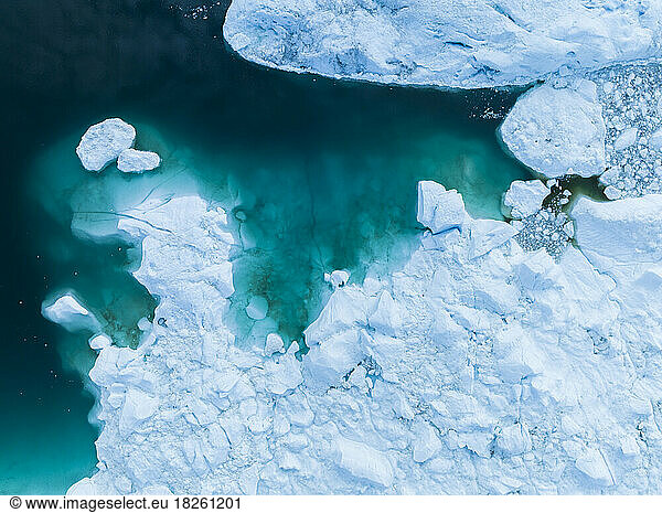 detail of extreme icebergs from aerial view in cenital