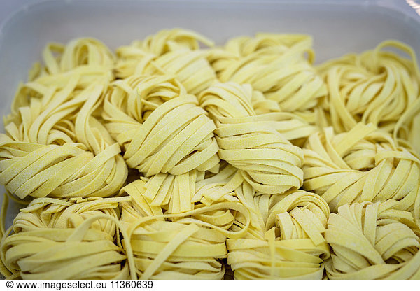 Detail of tagliatelle pasta in pasta factory