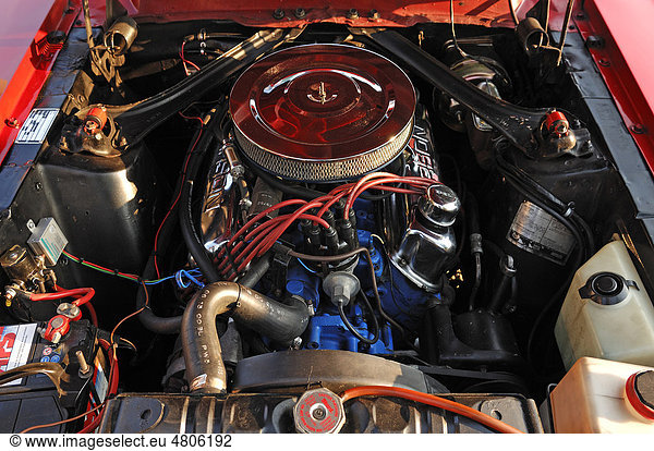 Detailed view of a classic car  engine bay of a Ford Mustang Convertible  built in 1967  147 kW  200 hp